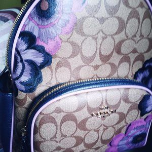Coach backpack with purple flowers